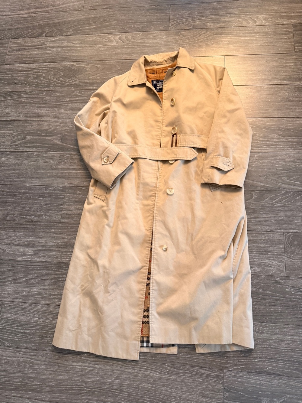 Burberry Beige Trench Coat with Signature Check Lining.
